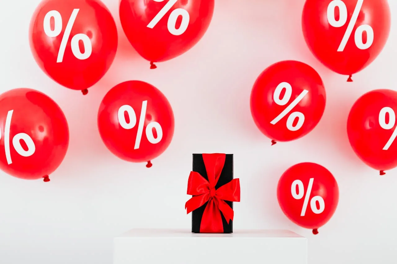 about-01 Red balloons with percent symbols and a gift box create a festive sale theme.